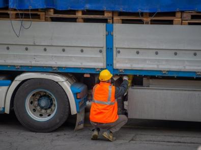 Man inspecting truck